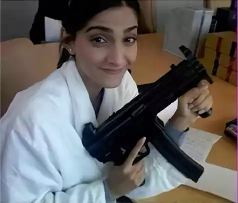 Sonam Kapoor with a gun